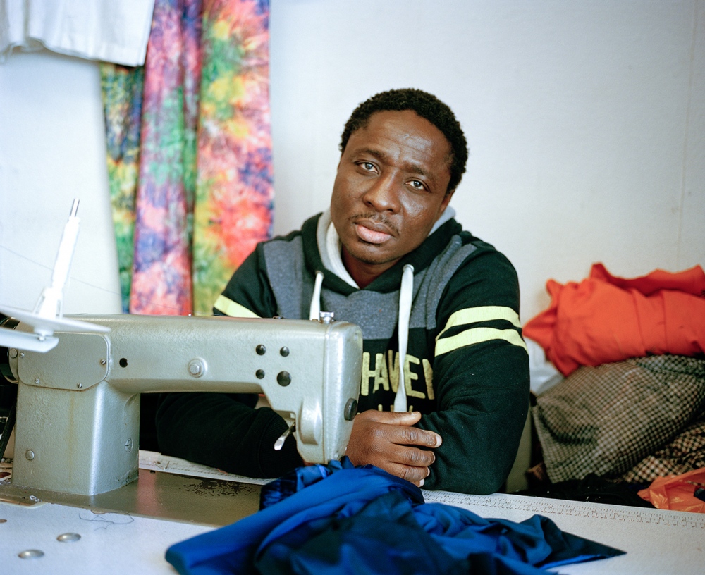  Billy works in a small corner premises making clothing. The business name is African Textiles,...