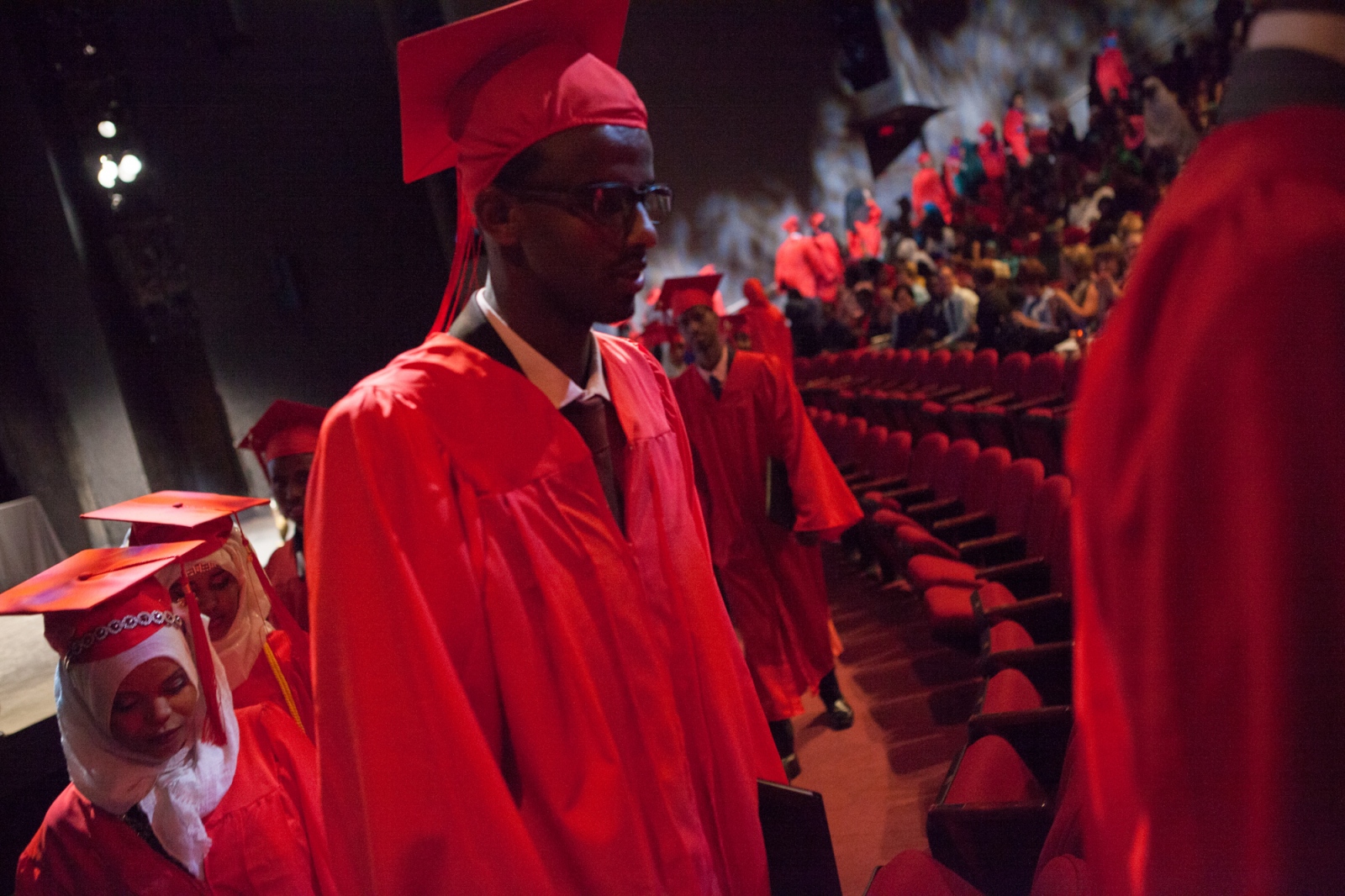  Graduating senior Mahamed Ahmed leaves at the end of the Lincoln International High School commencement ceremony. Lincoln is one of a number of...