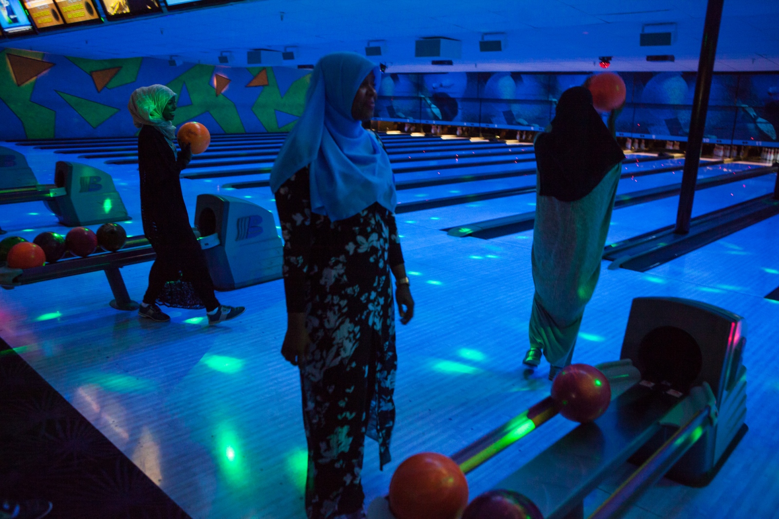  After dinner at the International House of Pancakes, a restaurant that is particularly popular among Somalis, a group of Somali friends go bowling. 