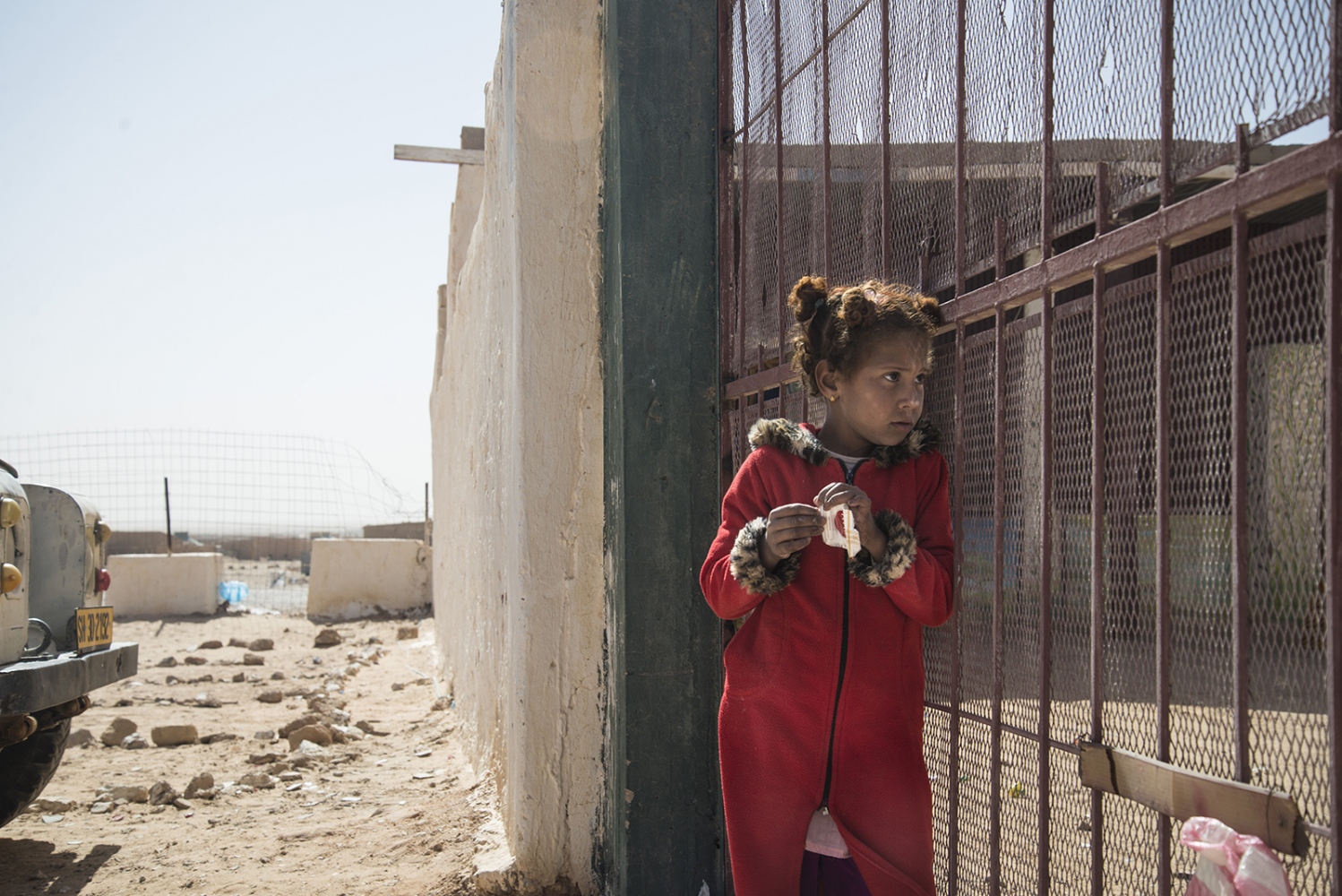 Behind The Wall, life of the Sahrawi -  A girl outside the gate of the protocol in Smara 