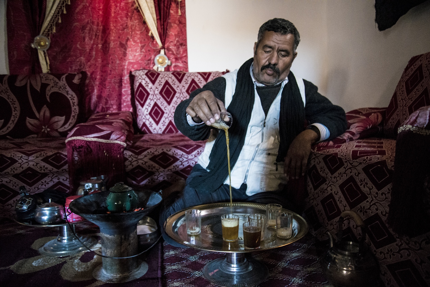 Behind The Wall, life of the Sahrawi -  A man is preparing tea according the Sahrawi tradition...