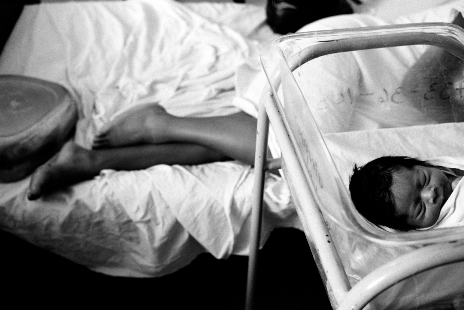 ABORTION IN EL SALVADOR FOR NY TIMES MAGAZINE -                 Resting mother and child in a maternity...