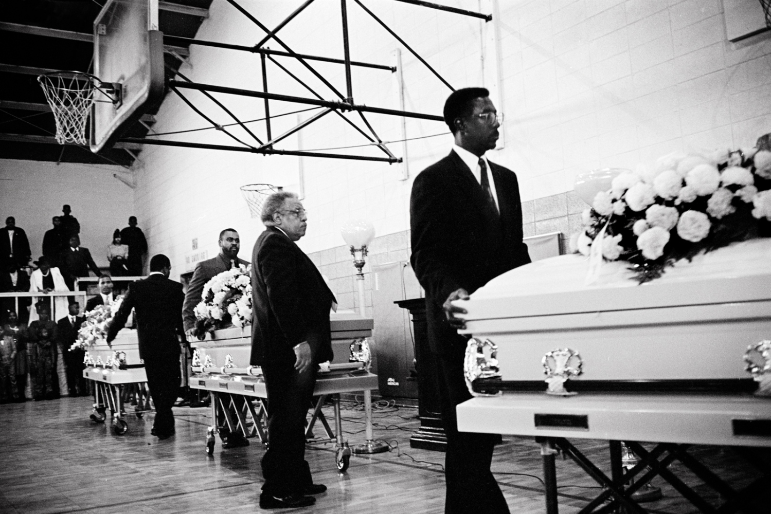 MISSISSIPPI FIRE FOR PEOPLE MAGAZINE - Pallbearers wheeled the caskets through Bruce High School...