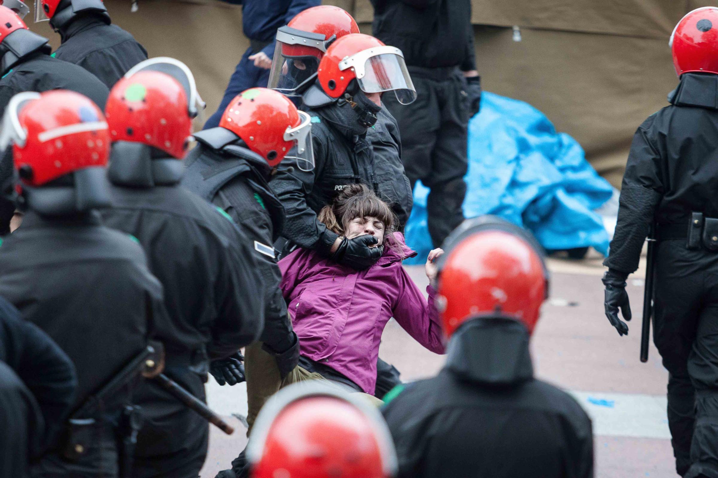 Basque Country - A young woman is forcibly removed by the police after...