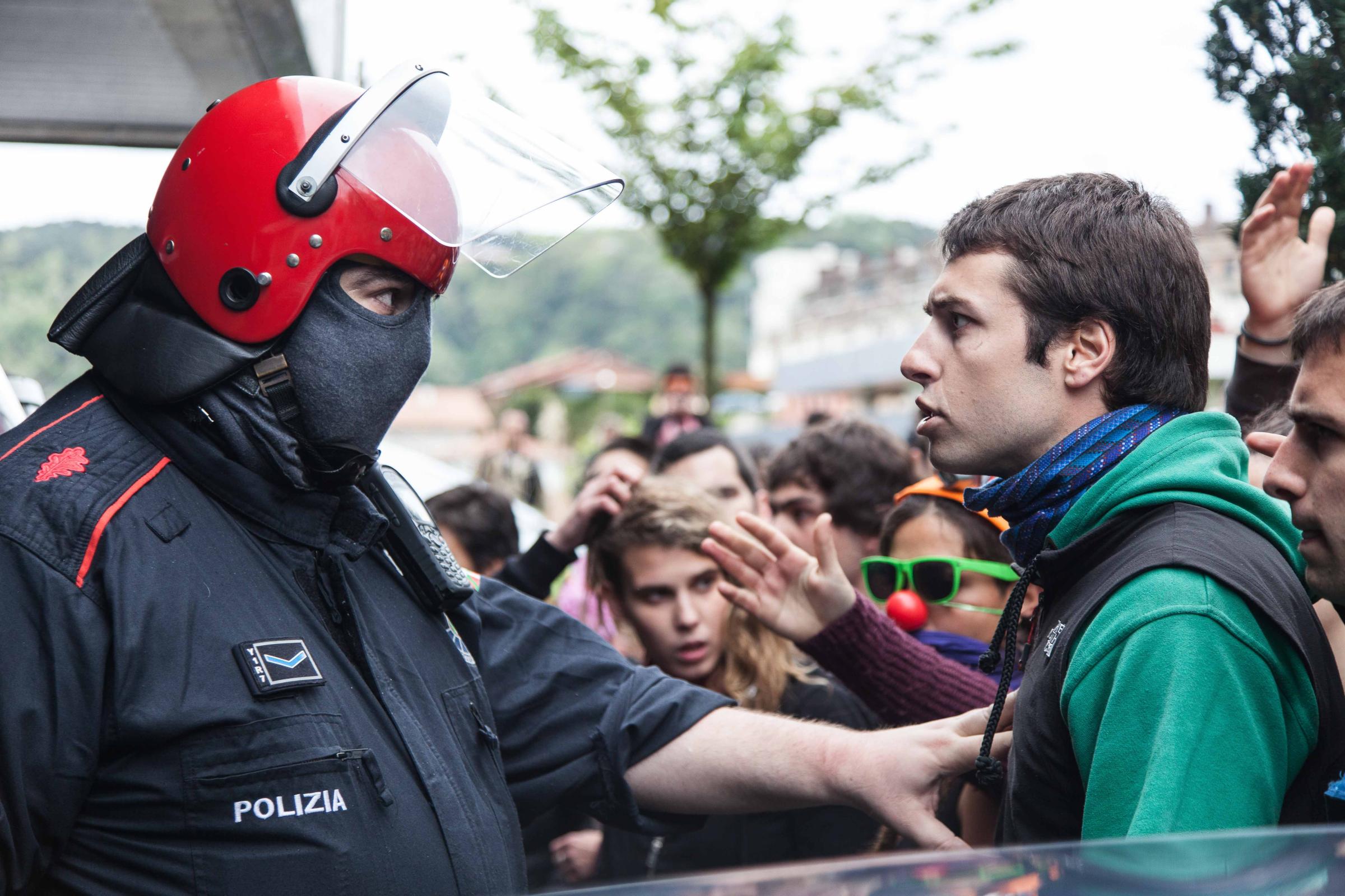 Basque Country - A young man and a Basque policeman face each other.  San sebastian, Gipuzkoa.