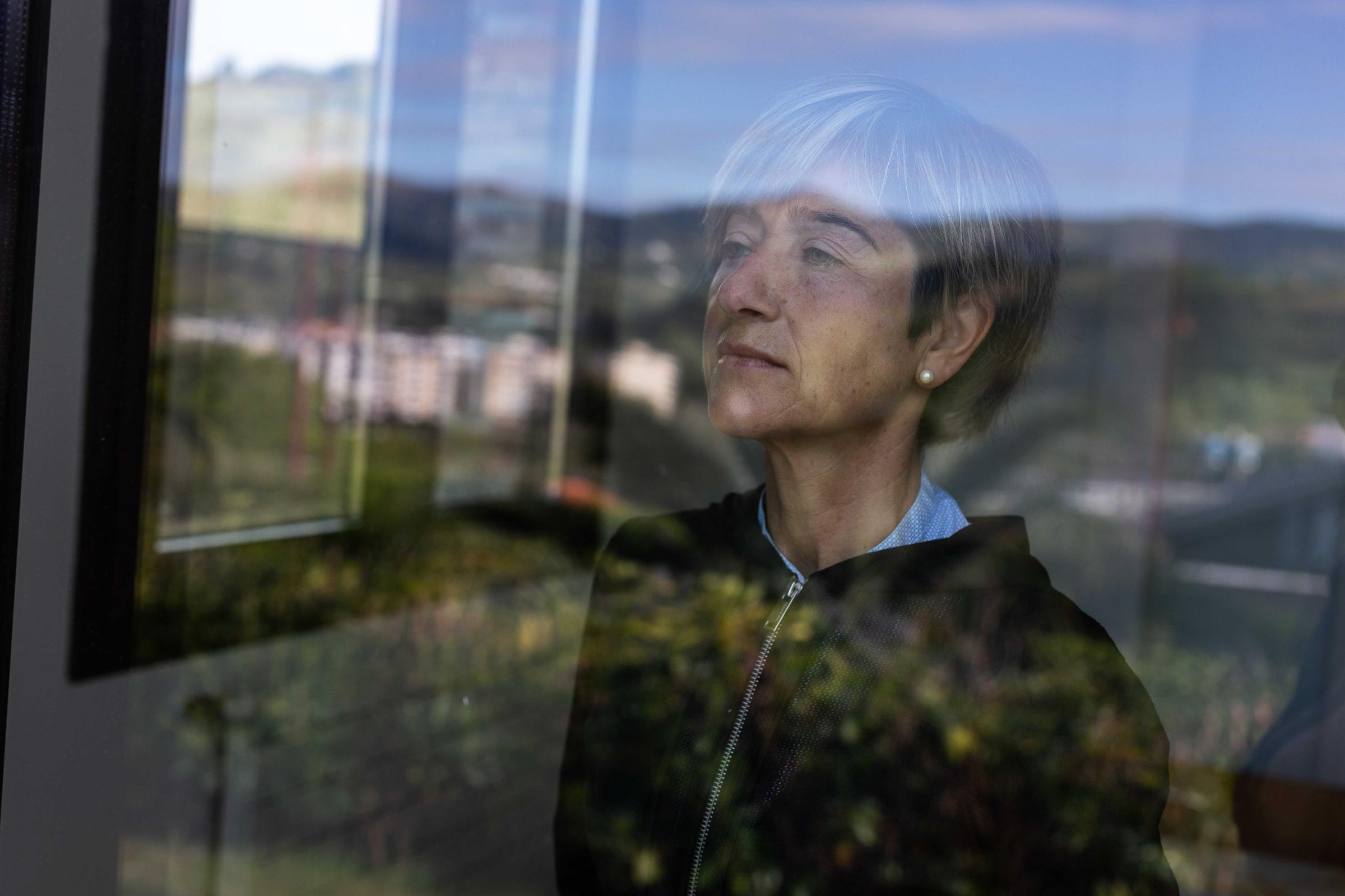 Basque Country -  Pili Zabala, sister of the alleged ETA member, Joxi Zabala, looks out from the window of her...