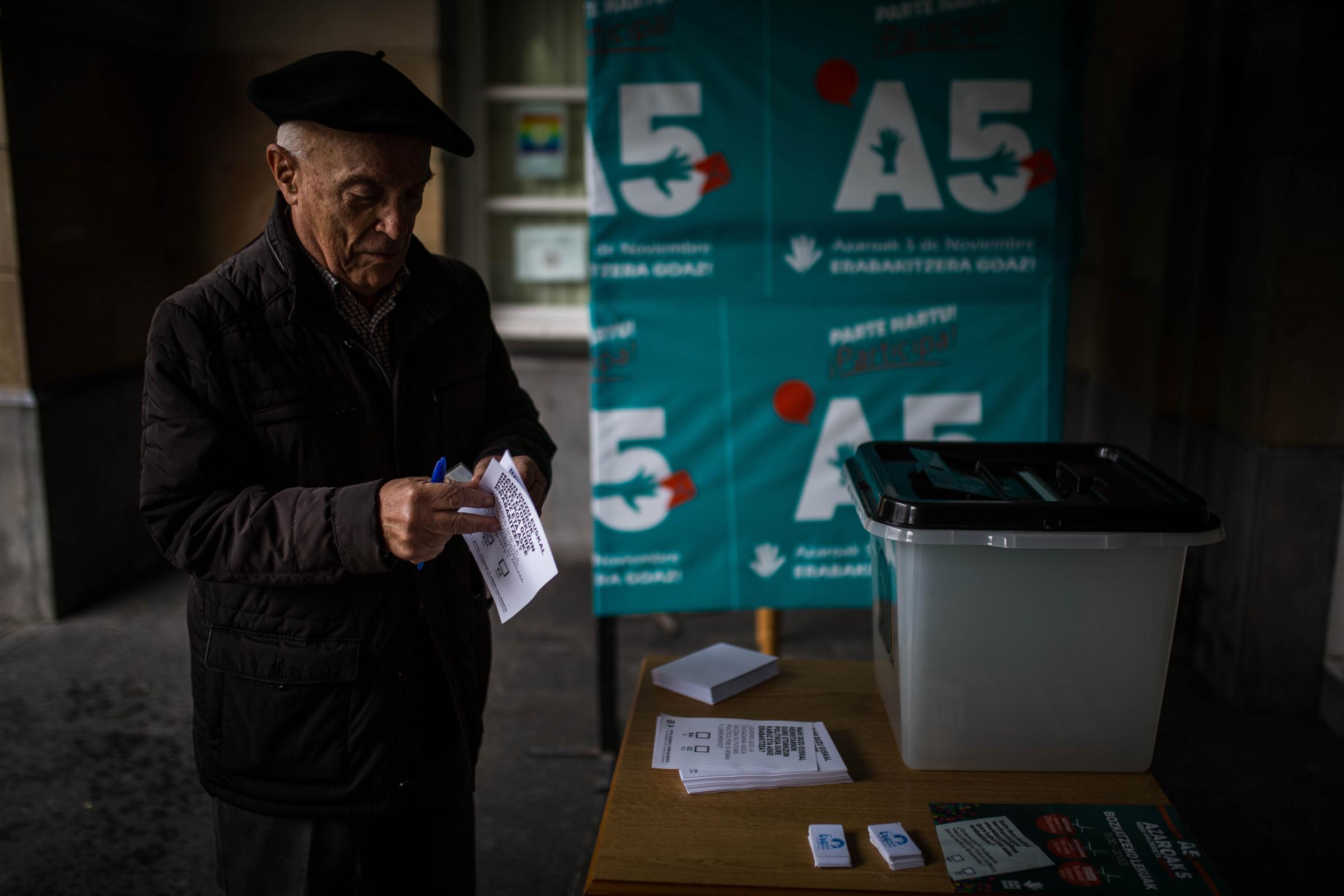 Basque Country -  A person during a consultation in favor of the Right to Decide in Areatza. Areatxa, Vizcaya 