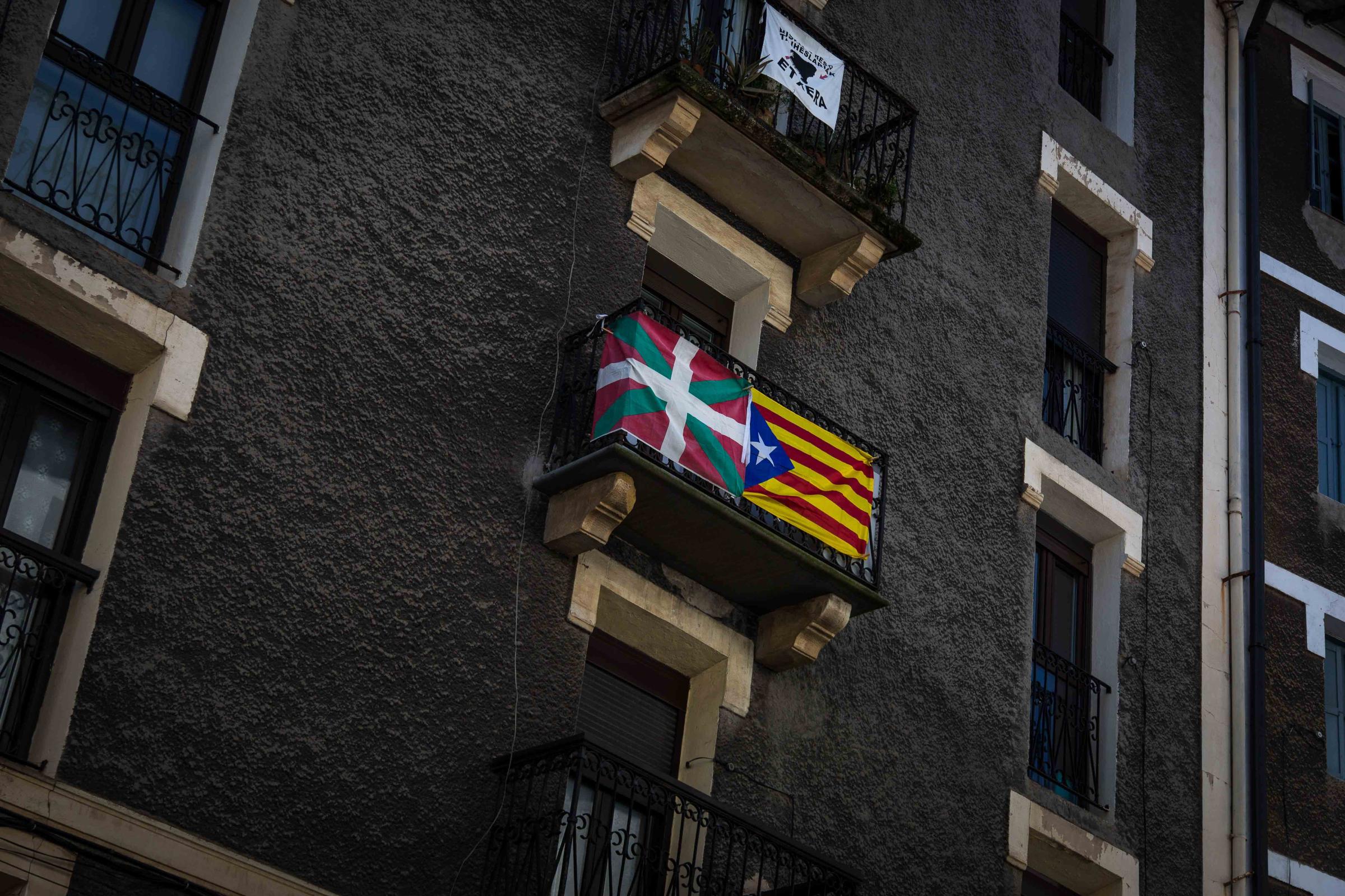 Basque Country - A Basque flag next to a Catalan flag on a balcony.  Errenteria, Gipuzkoa.