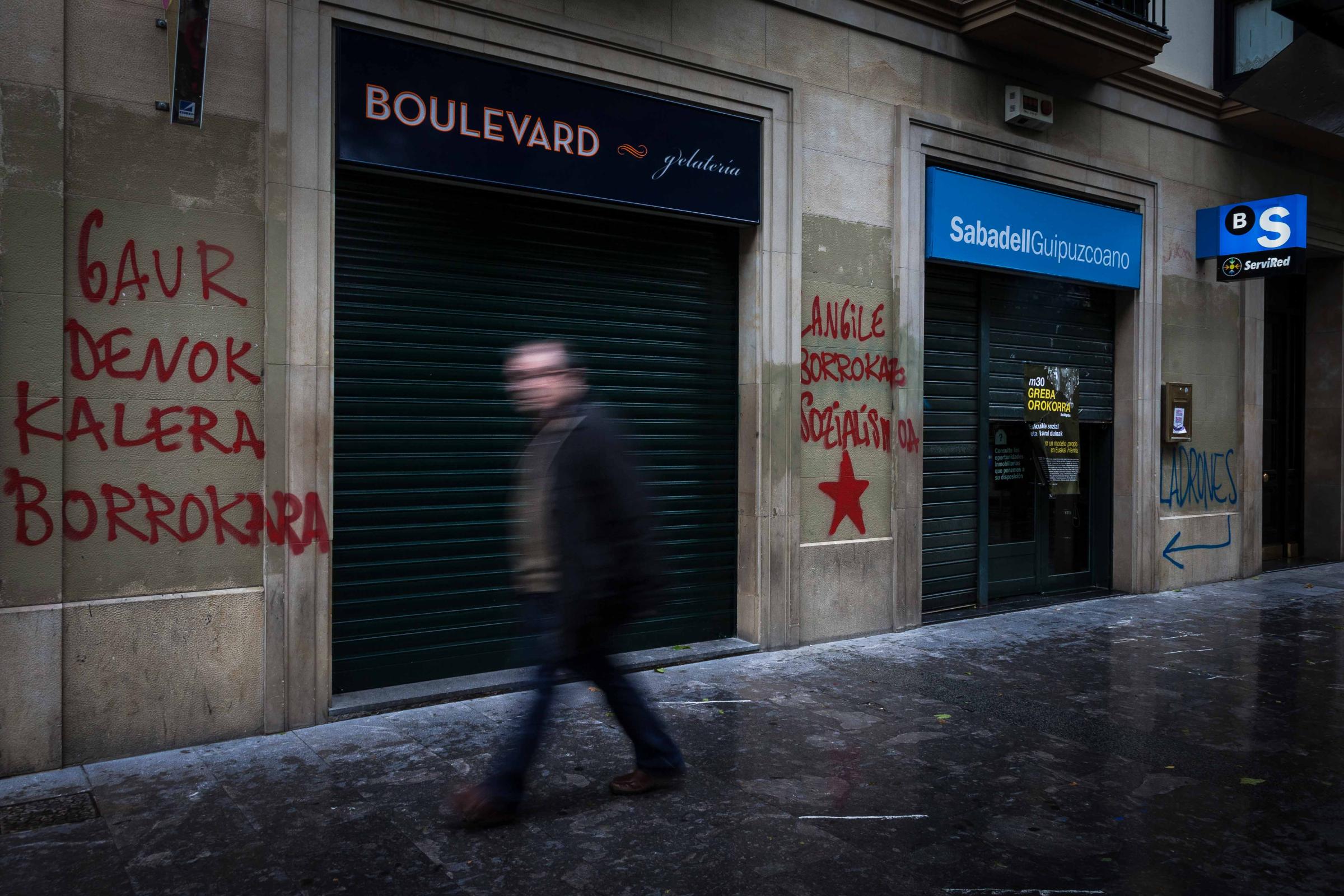 Basque Country - A man walks through the streets of SAn Sebastian during a general strike called by the Basque...