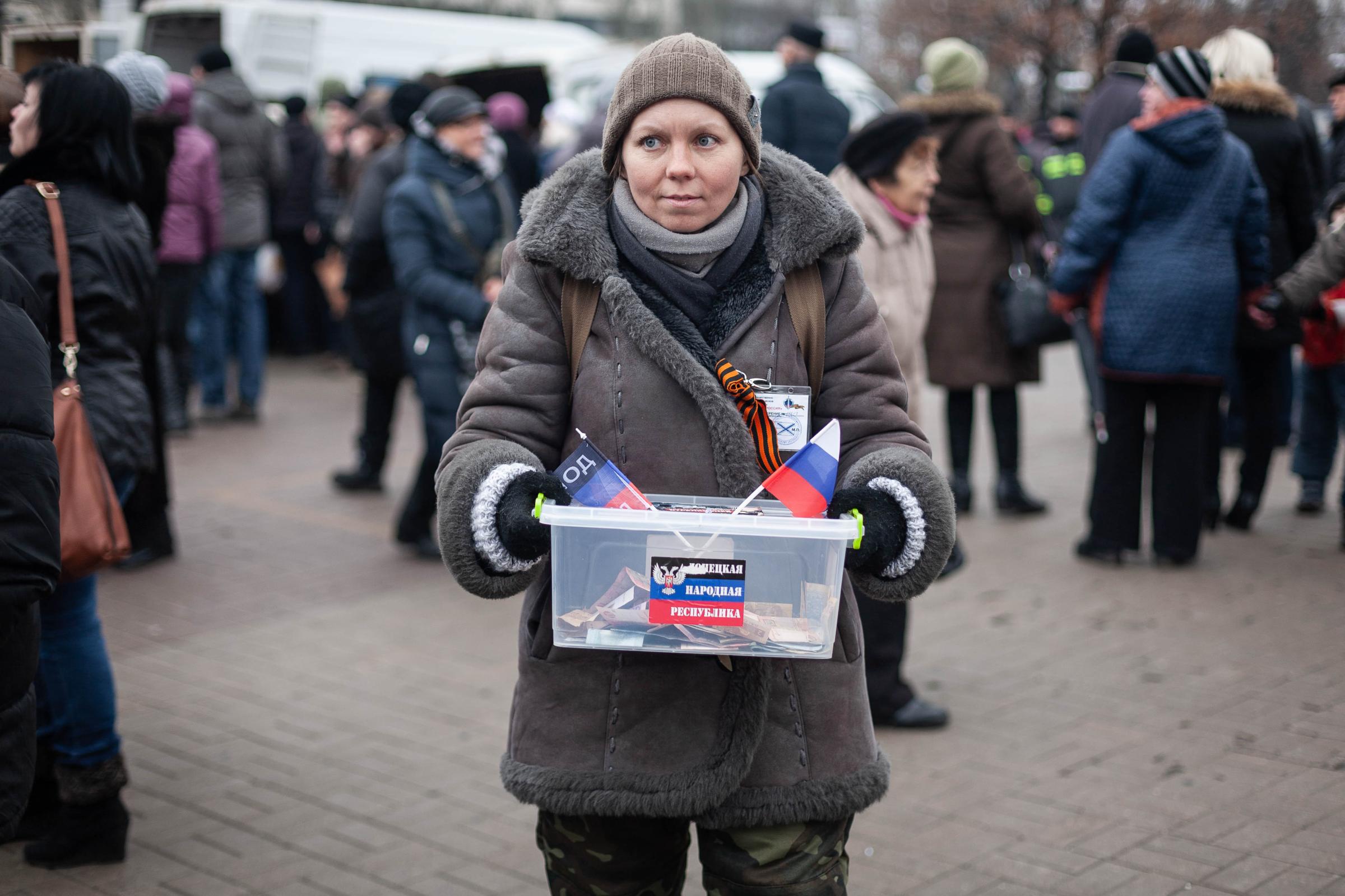 Truce in the Donbas -   December 2014. Donetsk, Ukraine. A woman hands out...