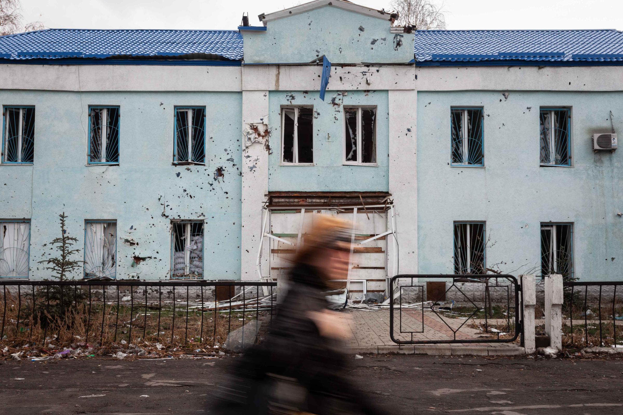 Truce in the Donbas -   December 2014. Donestk, Ukraine. A woman walks through...