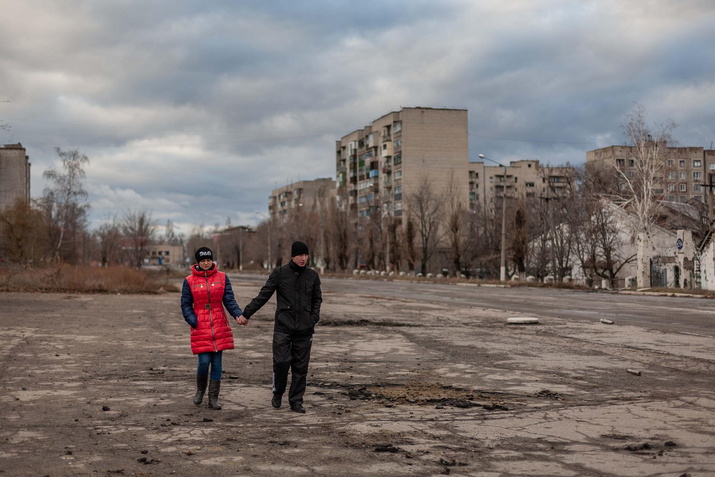 Truce in the Donbas -   December 2014. Lugansk, Ukraine. A couple walks through...