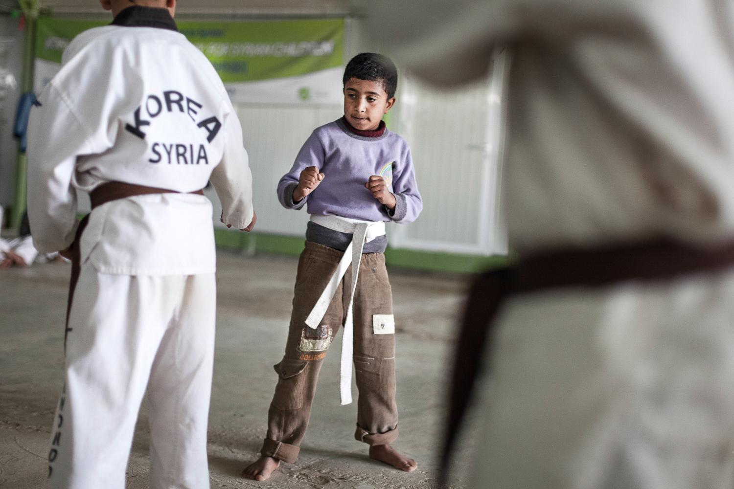 Zaatari Taekwondo School - Zaatari. Jordan. November 2014.  David Choi, the press...