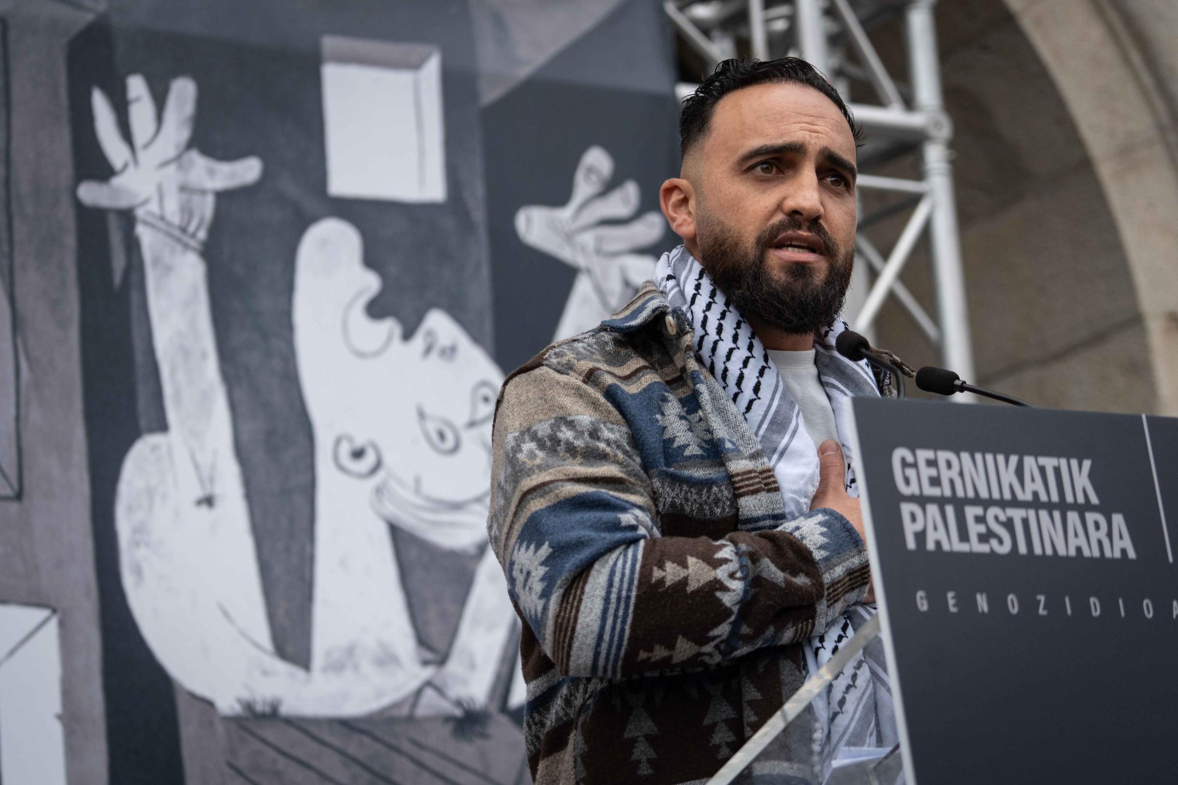 Over 3,000 people form human mosaic in Spain to support Palestine - GERNIKA, SPAIN - DECEMBER 8: Mohamed Farajallah, a Palestinian refugee, spoke on behalf of the...