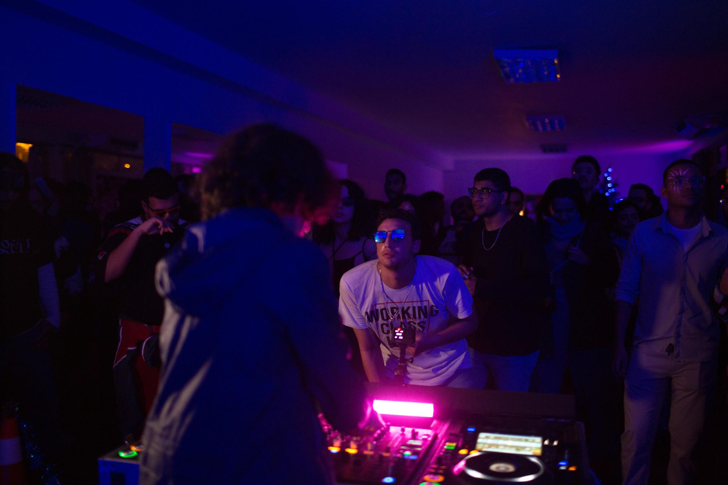 Female DJs navigate Egypt's underground music scene -  People attend a concert as Donia Shohdy, or...