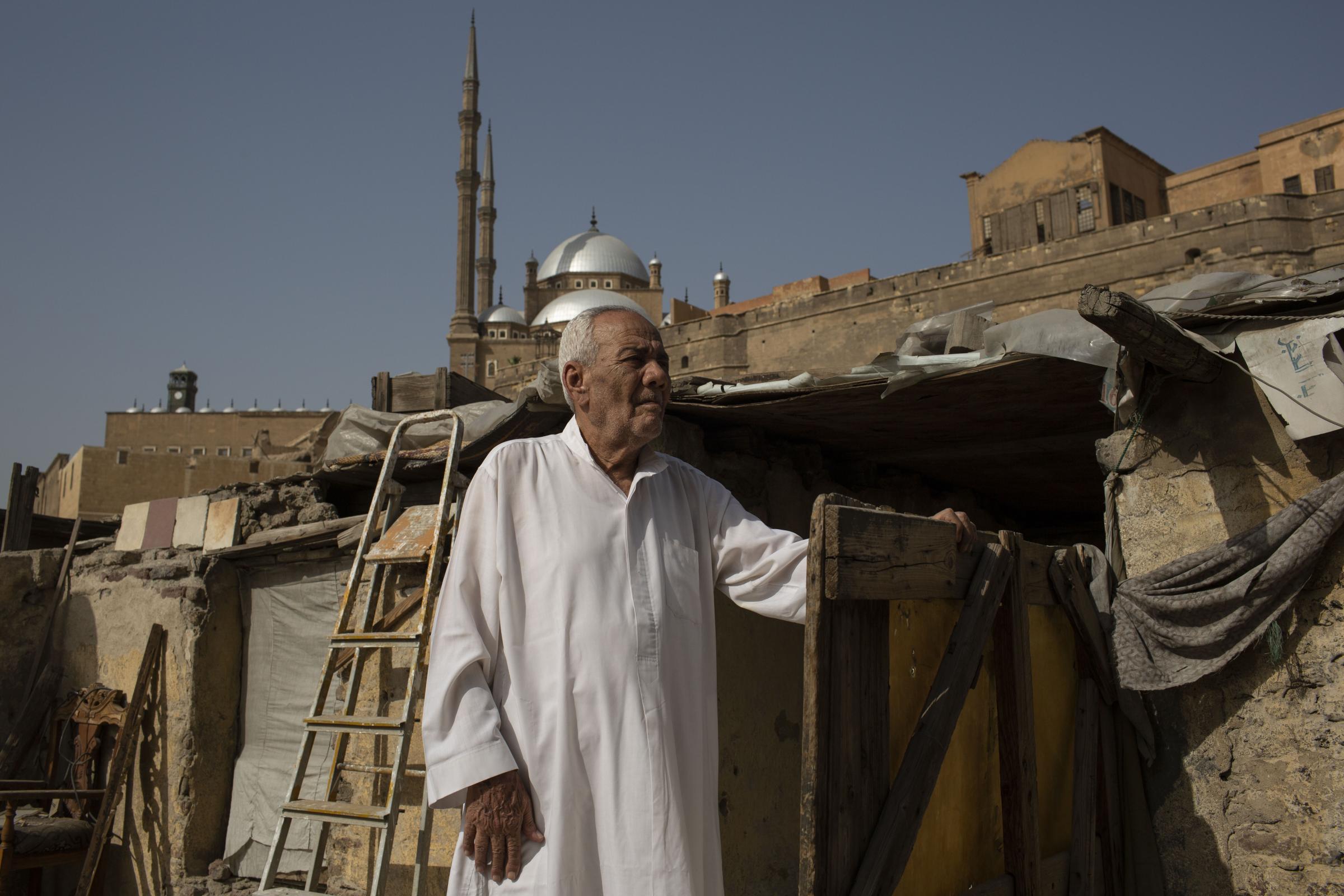 Ahmed Maher, 83, stands outside his home in the Majid house, built in 1880, which he hopes will not be demolished, across The City of the Dead,...