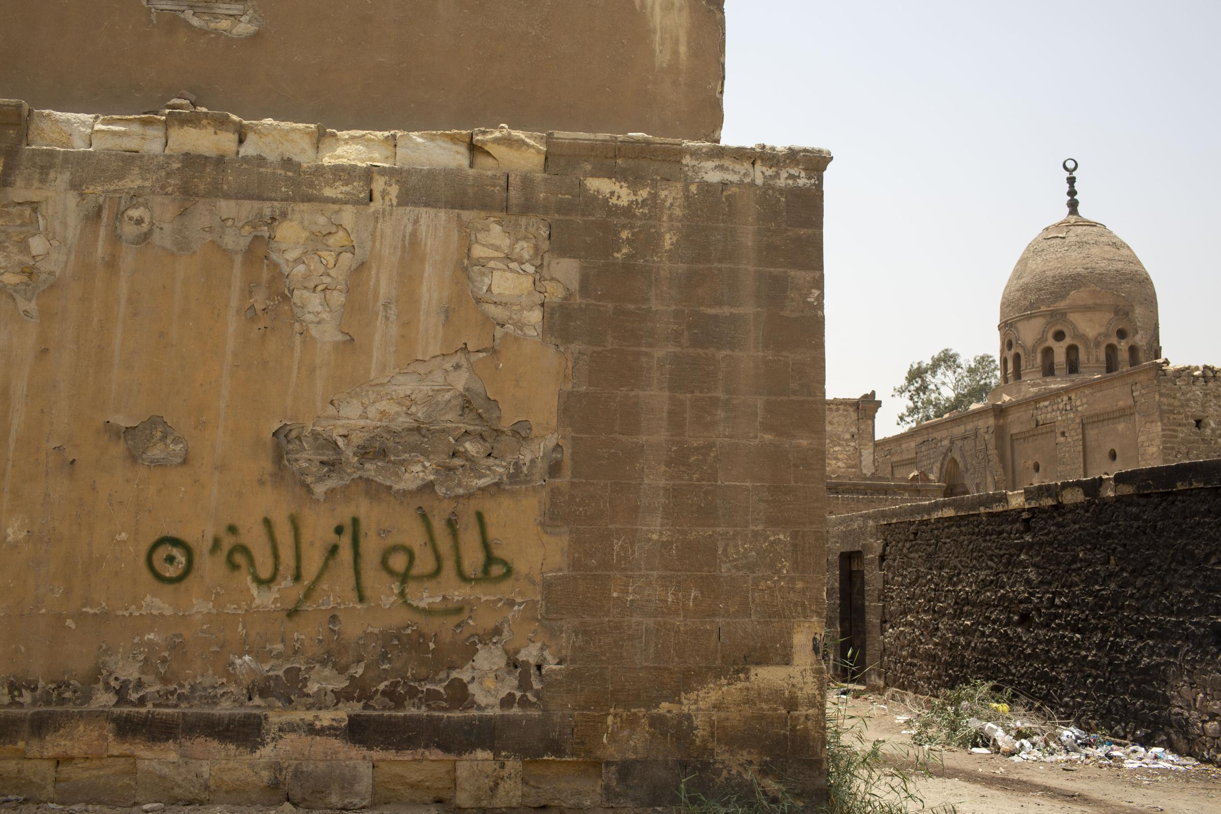 Bulldozers tear into Cairo's historic Islamic cemeteries - A view shows written words in Arabic reading "We...