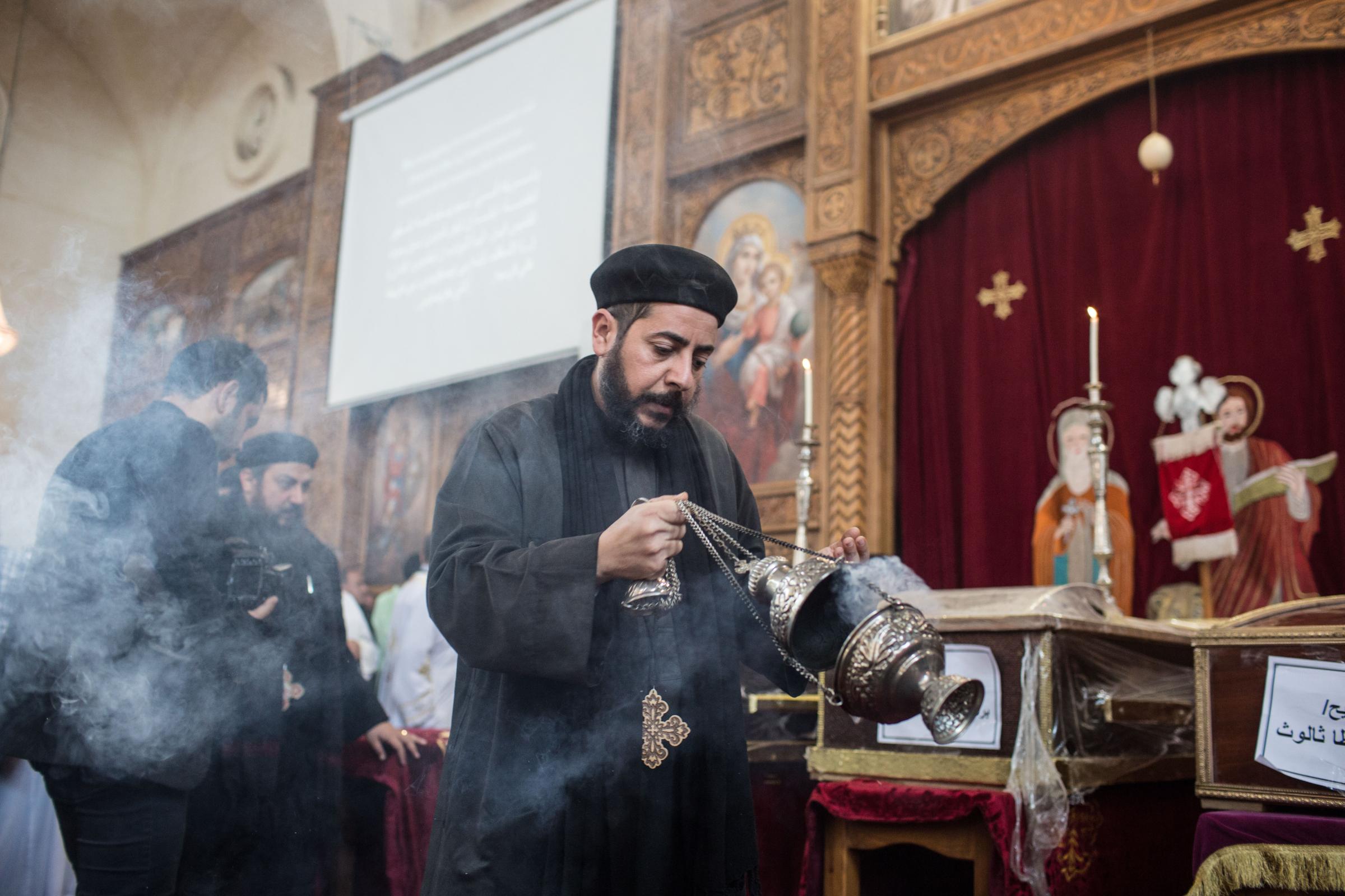 Funeral Mass for flood victims -  A Coptic Christian bishop at the St. Mark and St....
