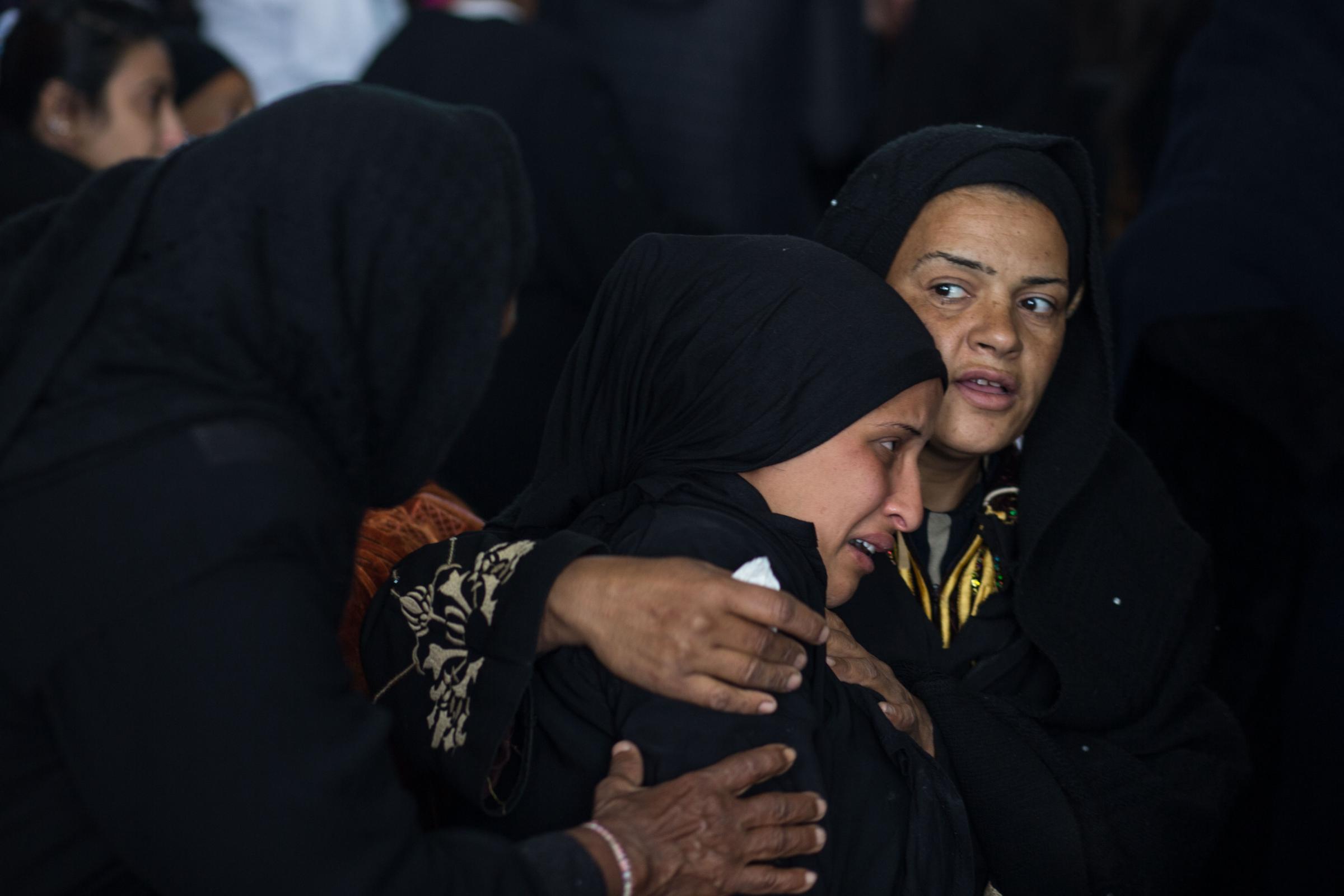 Funeral Mass for flood victims -  Mourners grieve at the St. Mark and St. Shenouda Church,...