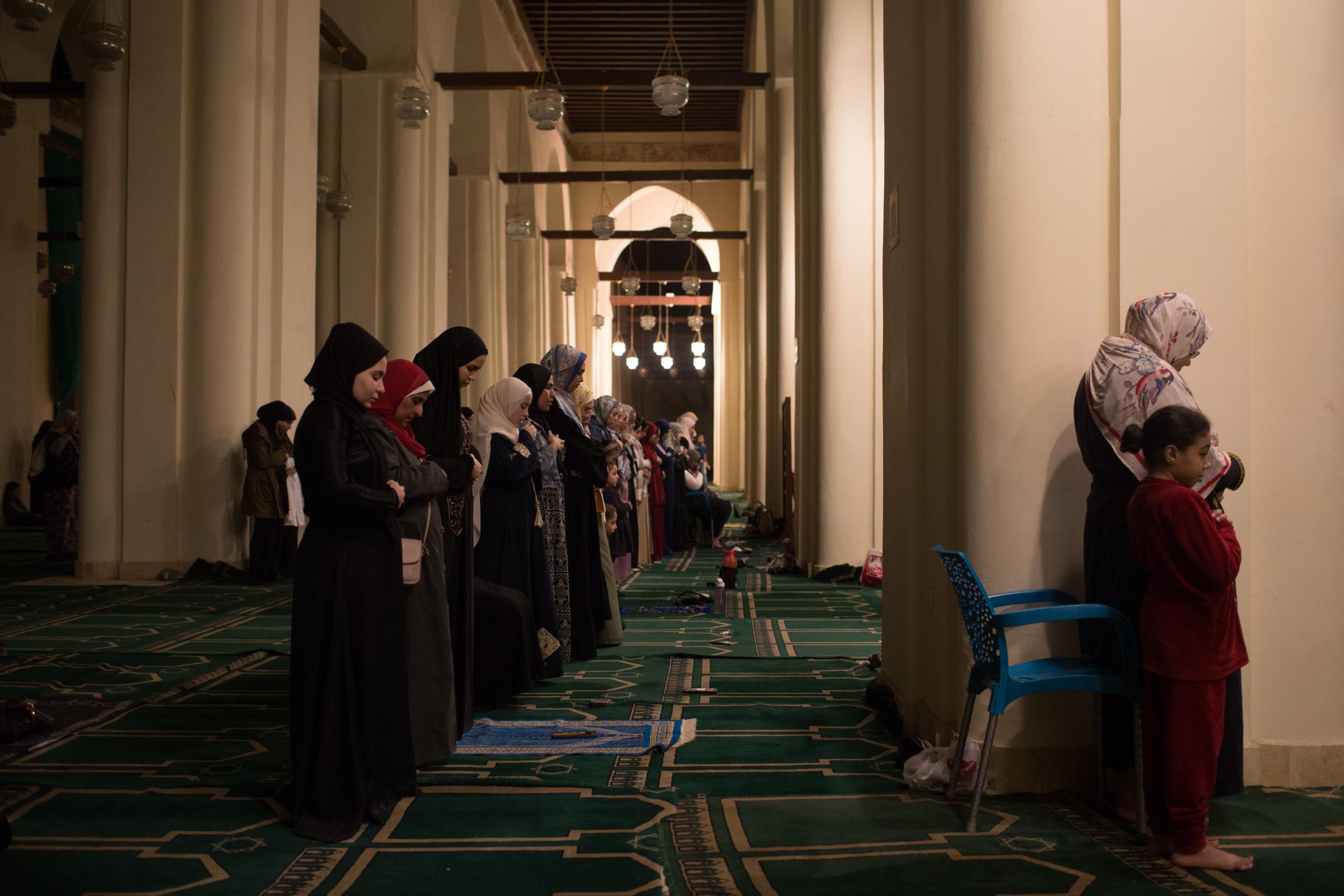 Ramadan in Cairo - Muslim women worshippers perform evening prayers called...