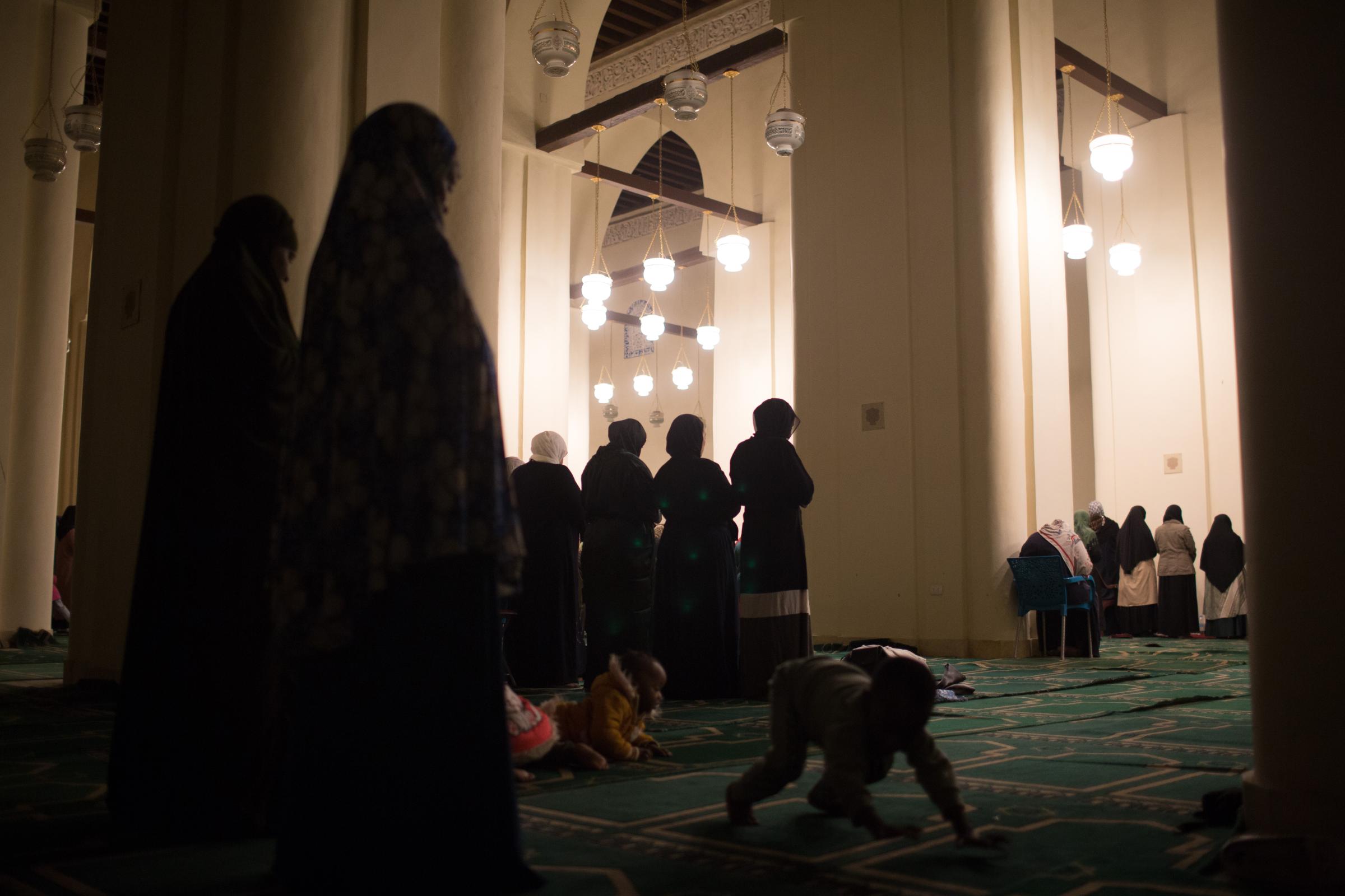 Ramadan in Cairo - Muslim women worshippers perform evening prayers called...
