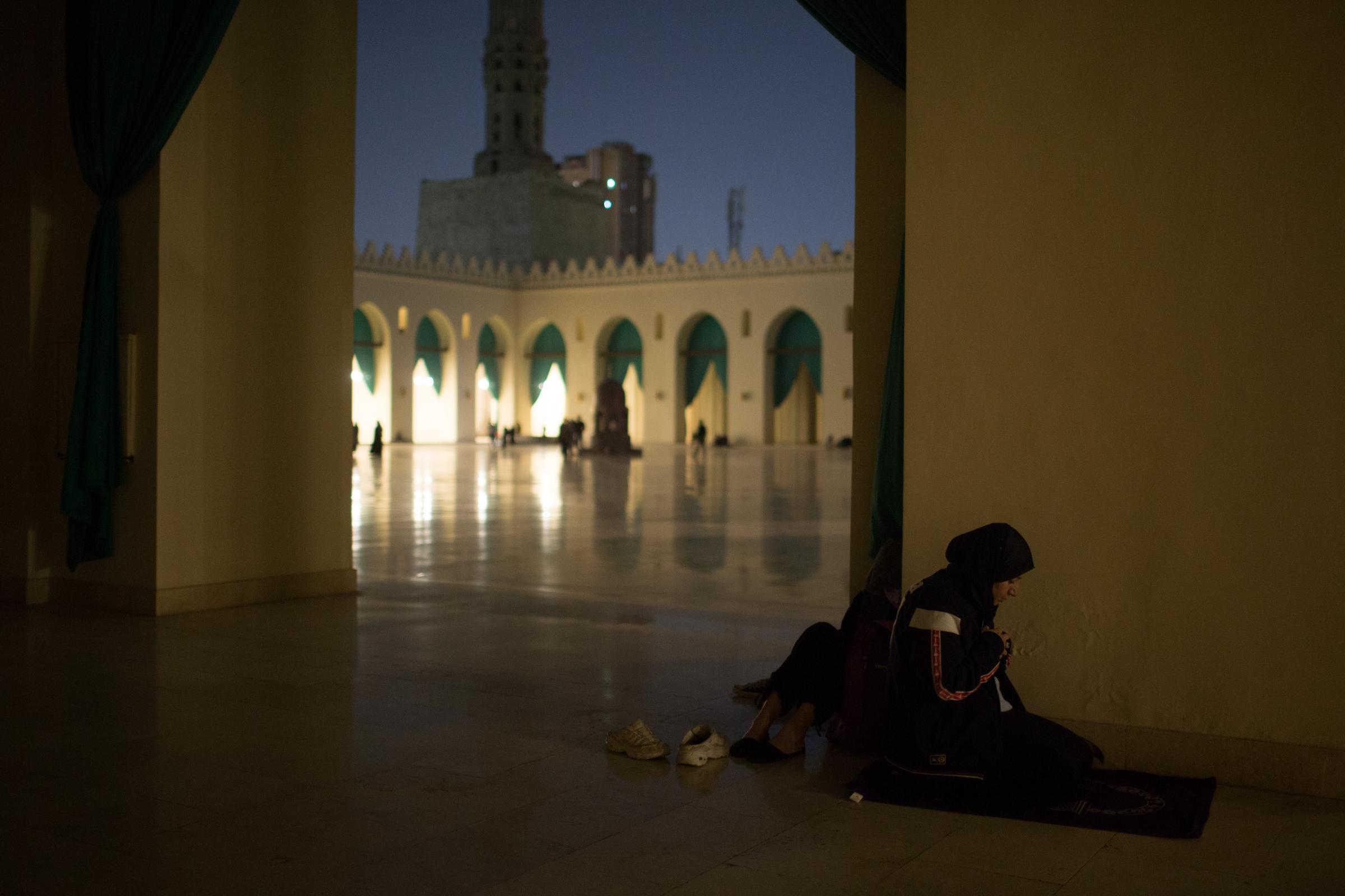 Ramadan in Cairo - A Muslim woman worshipper performs evening prayers called...