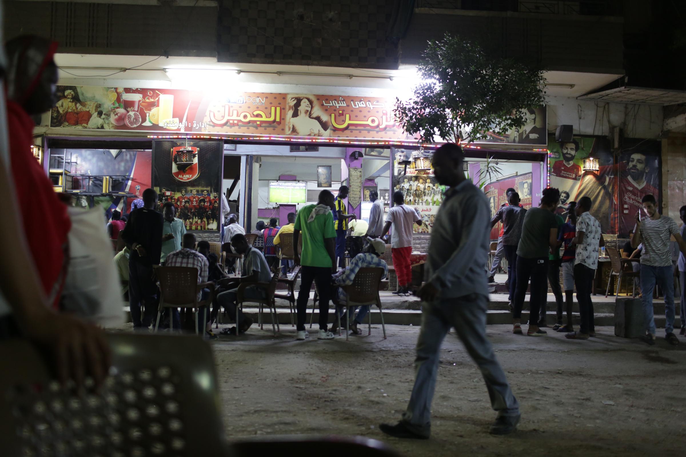 Sudanese head north to Egypt seeking brighter future - General view of a Sudanese coffee shop, where the number...