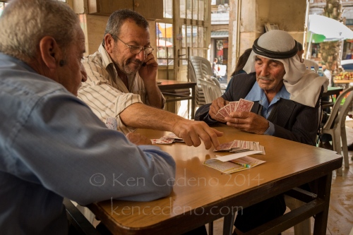 Image from ISRAEL -                 Arab men play cards in a huka bar April...
