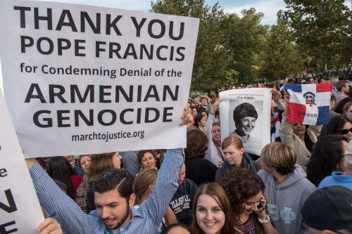 Image from POPE -                                 Supporters holds signs at...