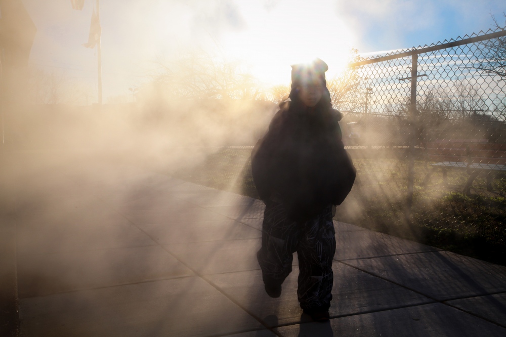 A young boy walks to the entrance of Stanton Elementary for class on a very cold January morning....