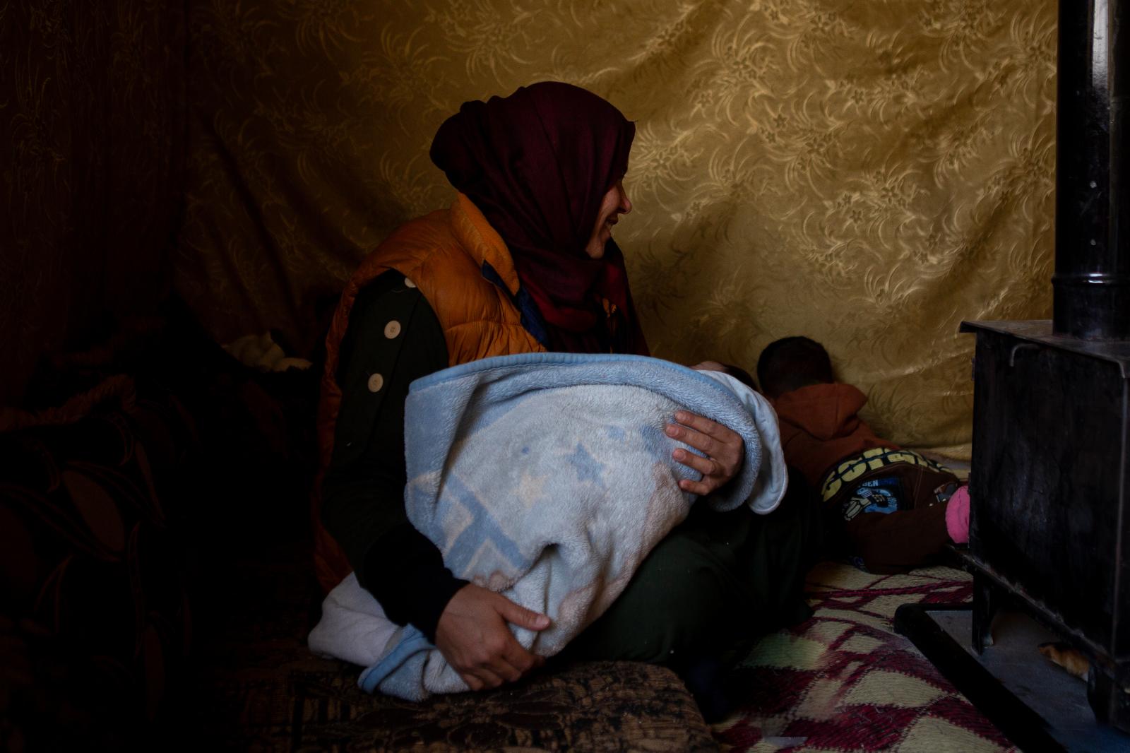 Nahla holds her son | Buy this image