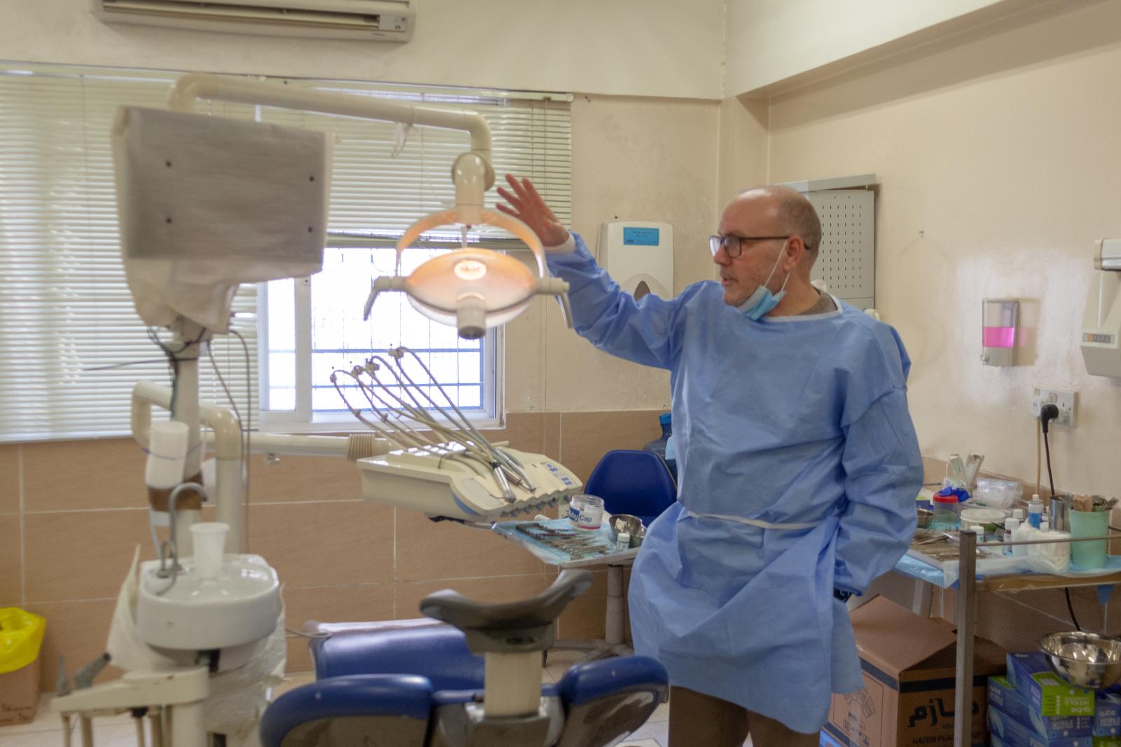Dr. Amjad Halaiqah shows a worn...fficult. Photo: Yousuf Sarfaraz