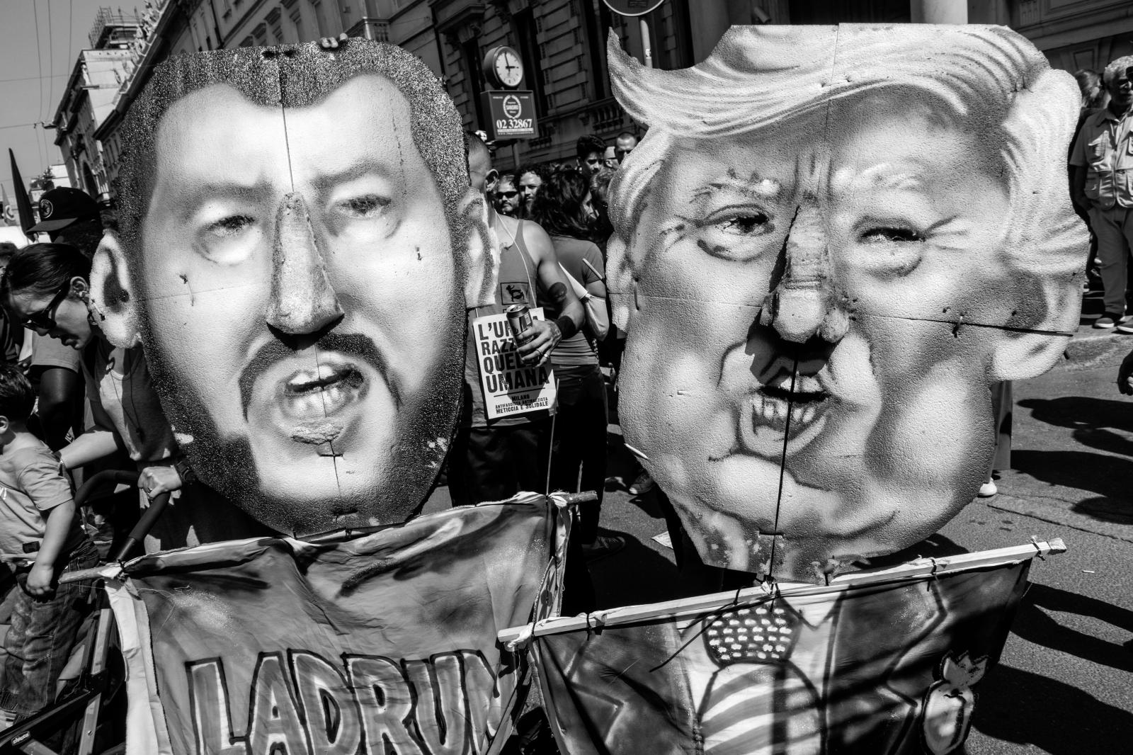 Huge masks of Salvini & Trump