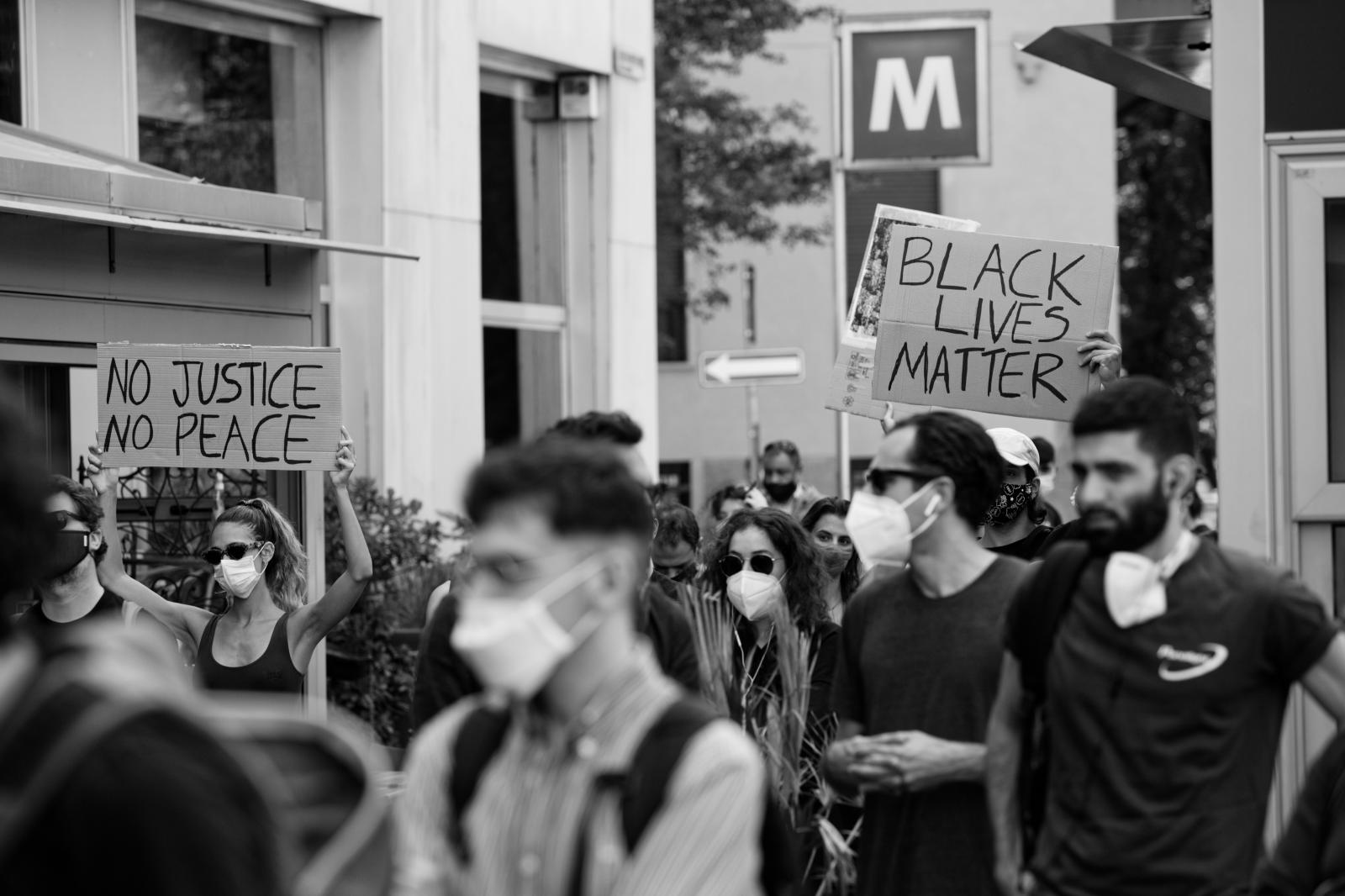 Demonstrators holding signs | Buy this image