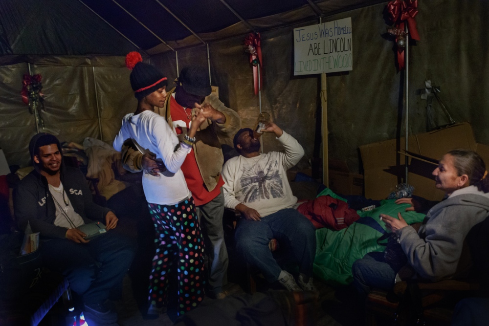  Inside Tent City&#39;s cha...p;quot; dances salsa with Eve. 