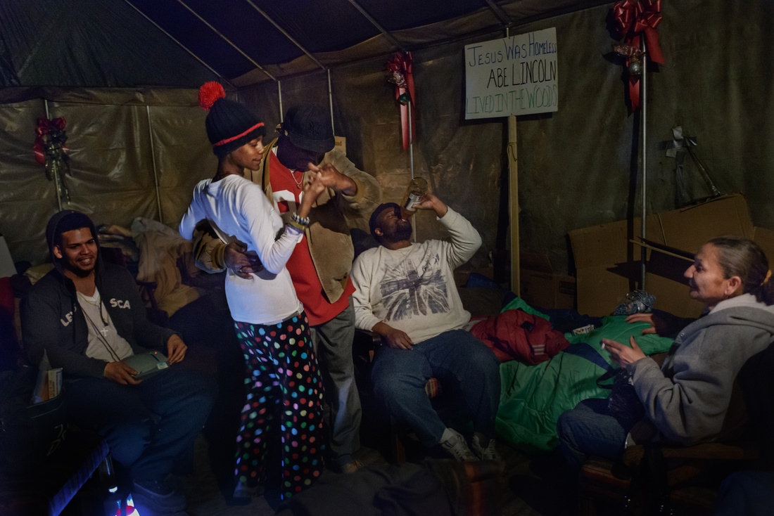  Inside Tent City&#39;s chapel, &quot;Uncle Mike&quot; dances salsa with Eve. 