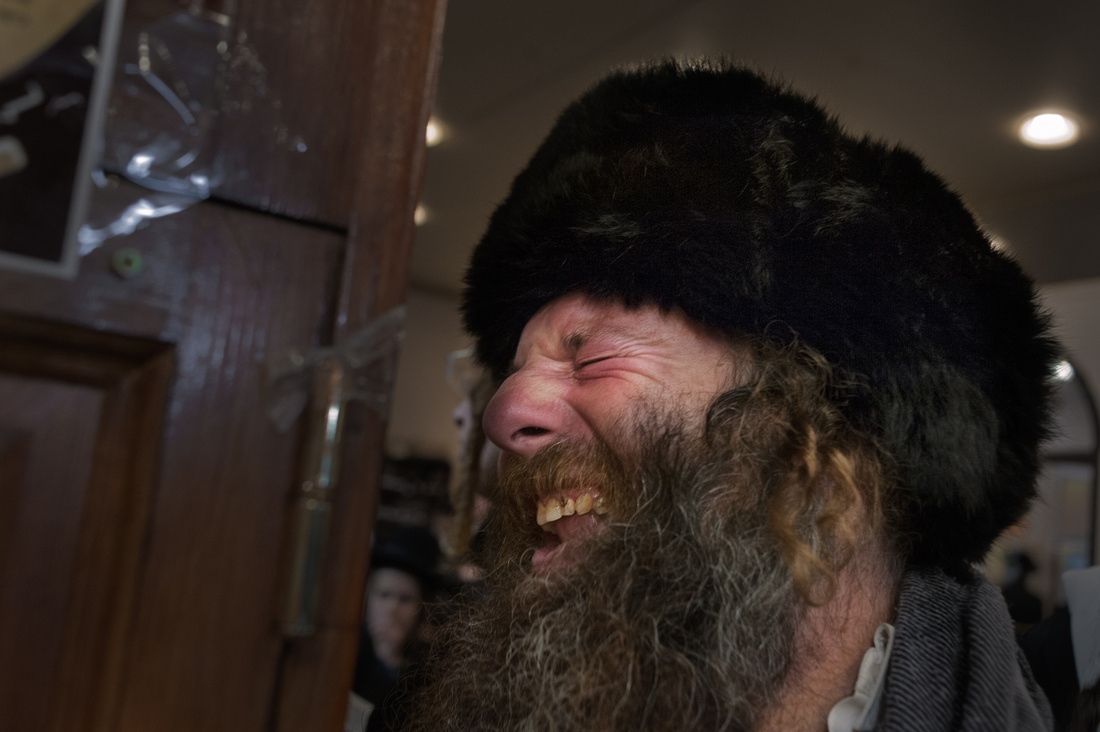 Rosh Hashanah- Ukraine -     A Hassidic man prays at the tomb of Rabbi Nachman....