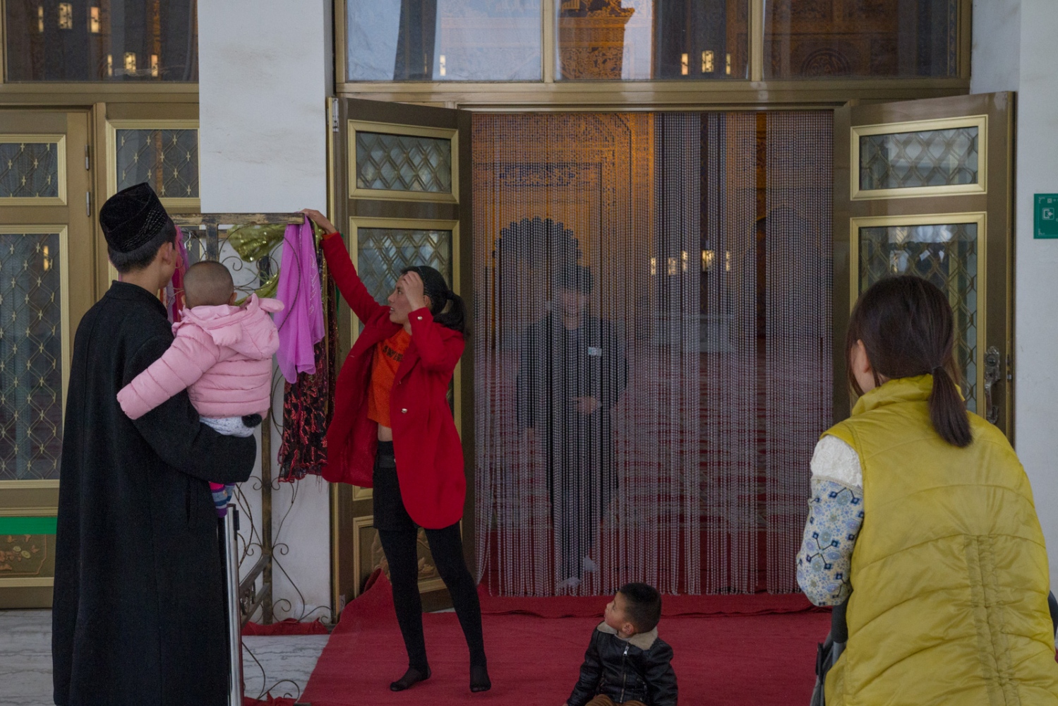 If China Builds It, Will the Arab World Come? -                 A visitor picks out a headscarf to wear...