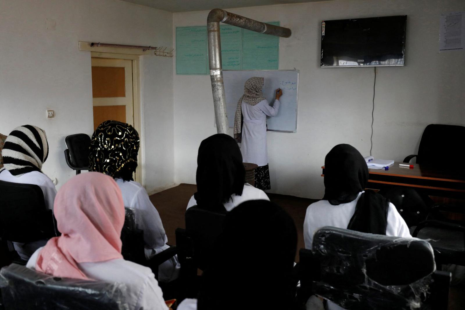 A teacher gives a lecture to tr...arch 2, 2023. REUTERS/Ali Khara