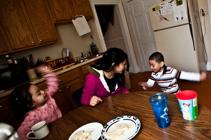     Isabel de Rosario tends to her son and step-daughter during lunch in Portland Maine on February 5th, 2011. De Rosario, a Guatemalan immigrant, had to move out of her house after incidents of domestic abuse against her and her children had put them at serious physical risk. Because they are undocumented, reporting the crimes to the police is impossible.     