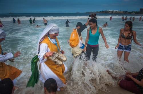      Nuns wade in the Copacabana beach water, in Rio de Janeiro, Brazil, Sunday, July 28, 2013. Pope Francis wrapped up a historic trip to his home continent Sunday with the World Youth Day's closing Mass on the Copacabana beachfront. He was leaving for Rome Sunday night.     