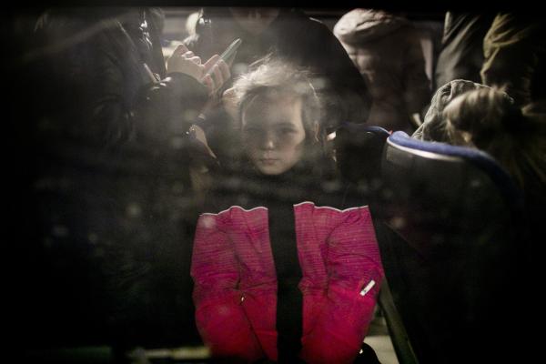 Ukraine-Russia War - Her sorrow clearly evident, a  Ukrainian child,...