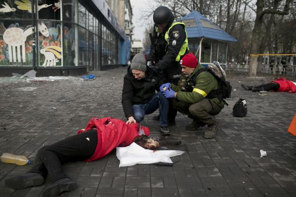 Image from Ukraine-Russia War - Oleksii Afanasievska (Center- 38 years old) mourns over...