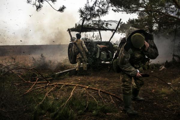 Ukraine-Russia War - Ukrainian soldiers ,firing a Howitzer D-30, towards...