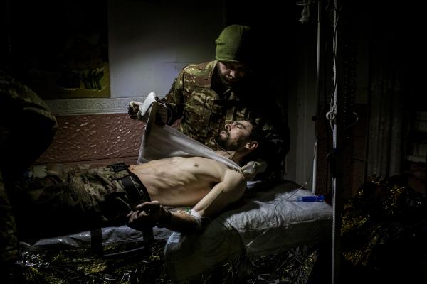 Ukraine-Russia War - A Ukrainian army medic treats a soldier who was injured...