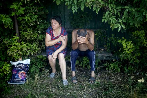 Image from Ukraine-Russia War - Civilians react in shock, after a Russian army airstrike...