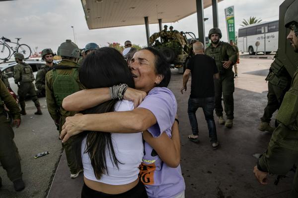 Image from The October 7th War - Sigal Yacobi embraces her daughter after being rescued by...
