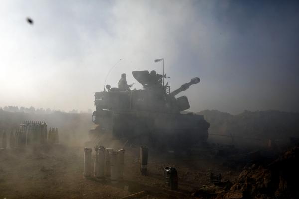 Image from The October 7th War - An IDF M109 howitzer fires towards targets inside Gaza as...