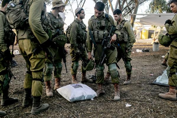 Image from The October 7th War - IDF soldiers inspecting Nova party goers belongings,...