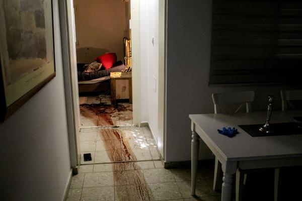 Image from The October 7th War - Blood stains that leads into a home shelter inside a...